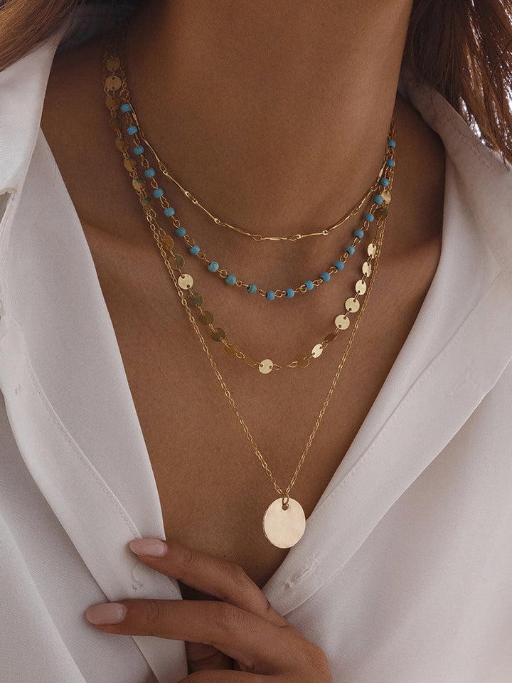 Gold-Tone Layered Necklace with Beads and Disc Pendant