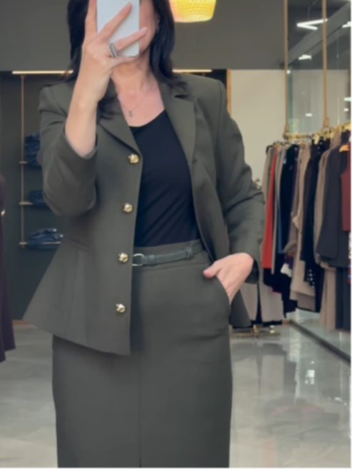 Olive green suit jacket and skirt commuter suit